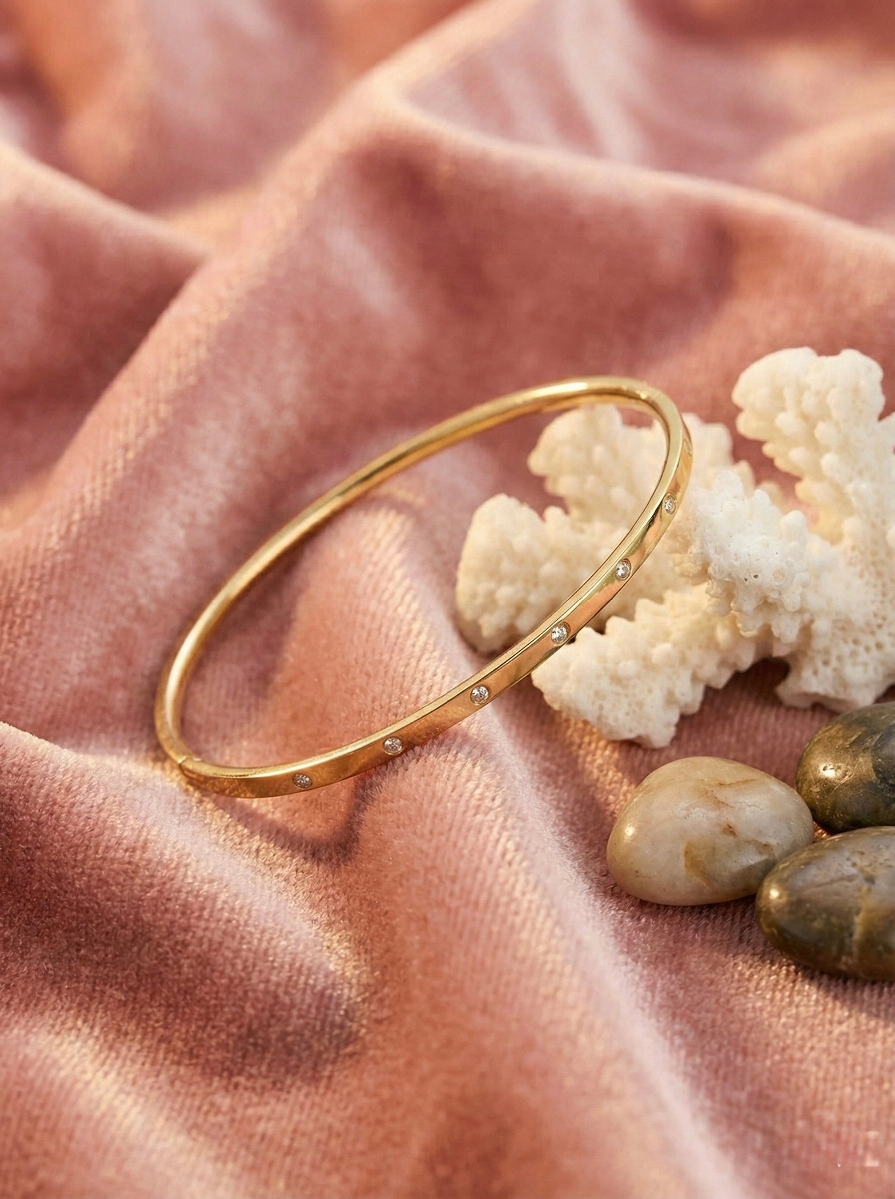 Close-up detail of anti-tarnish gold CZ averis bangle bracelet