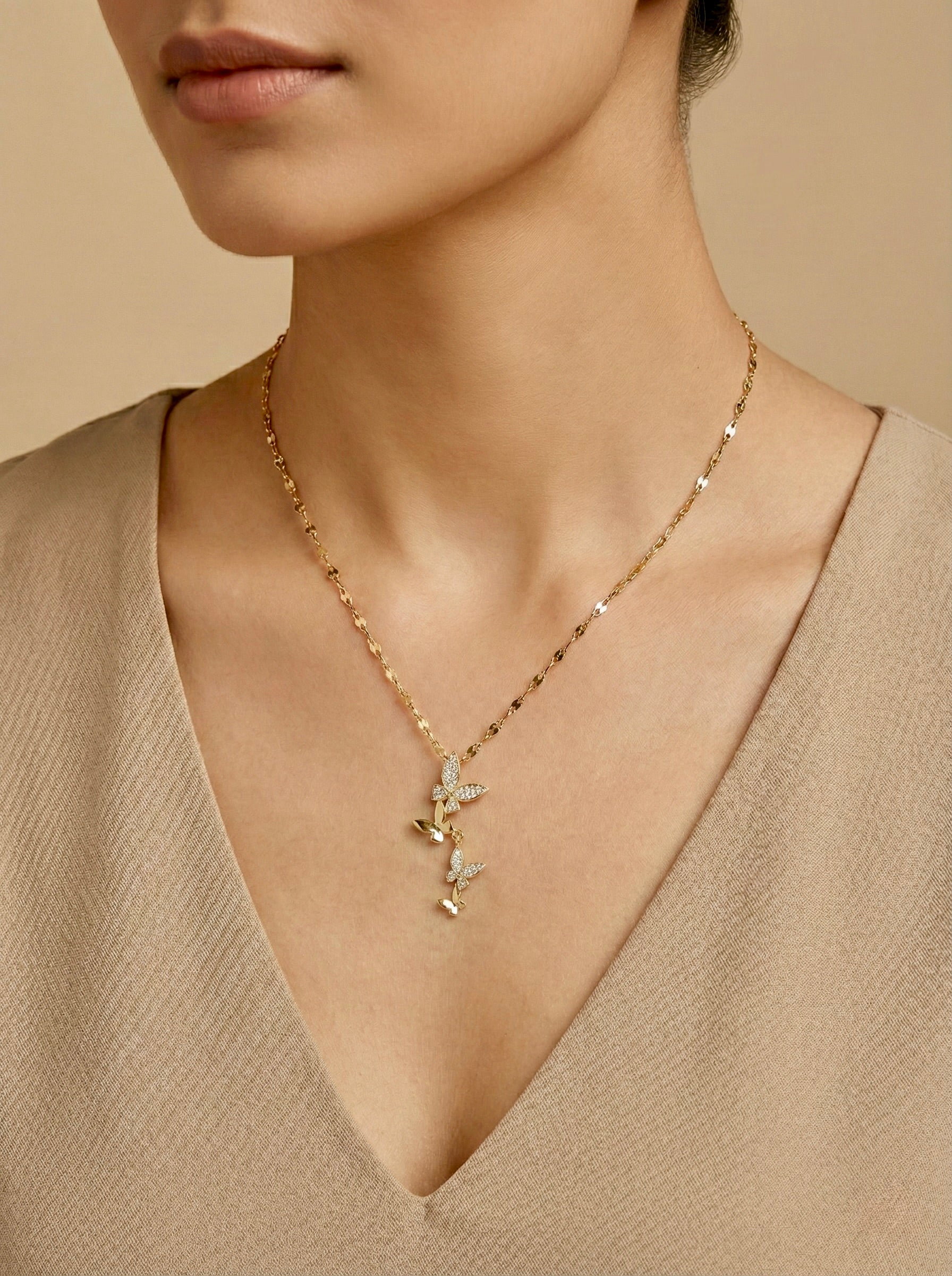 Sparkling Aurethia butterfly drop necklace worn on model for everyday elegant styling