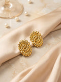 Aurevia Bloom gold statement stud earrings with anti-tarnish finish and sculptural floral design
