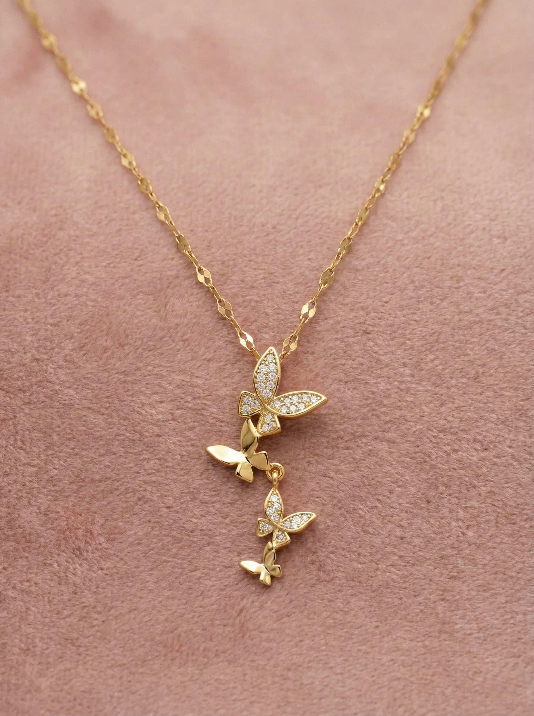 Front view of anti-tarnish gold butterfly drop necklace with delicate chain