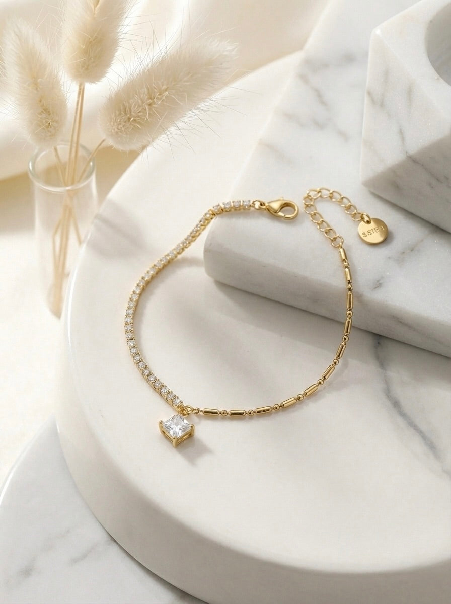 Celestia Dual Spark gold CZ statement bracelet with anti-tarnish finish and square crystal charm