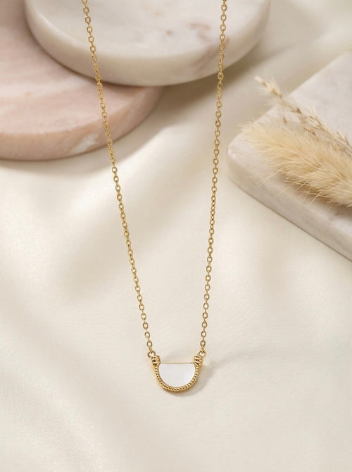 Dazzling gold Arvella arc pendant necklace styled for everyday elegance