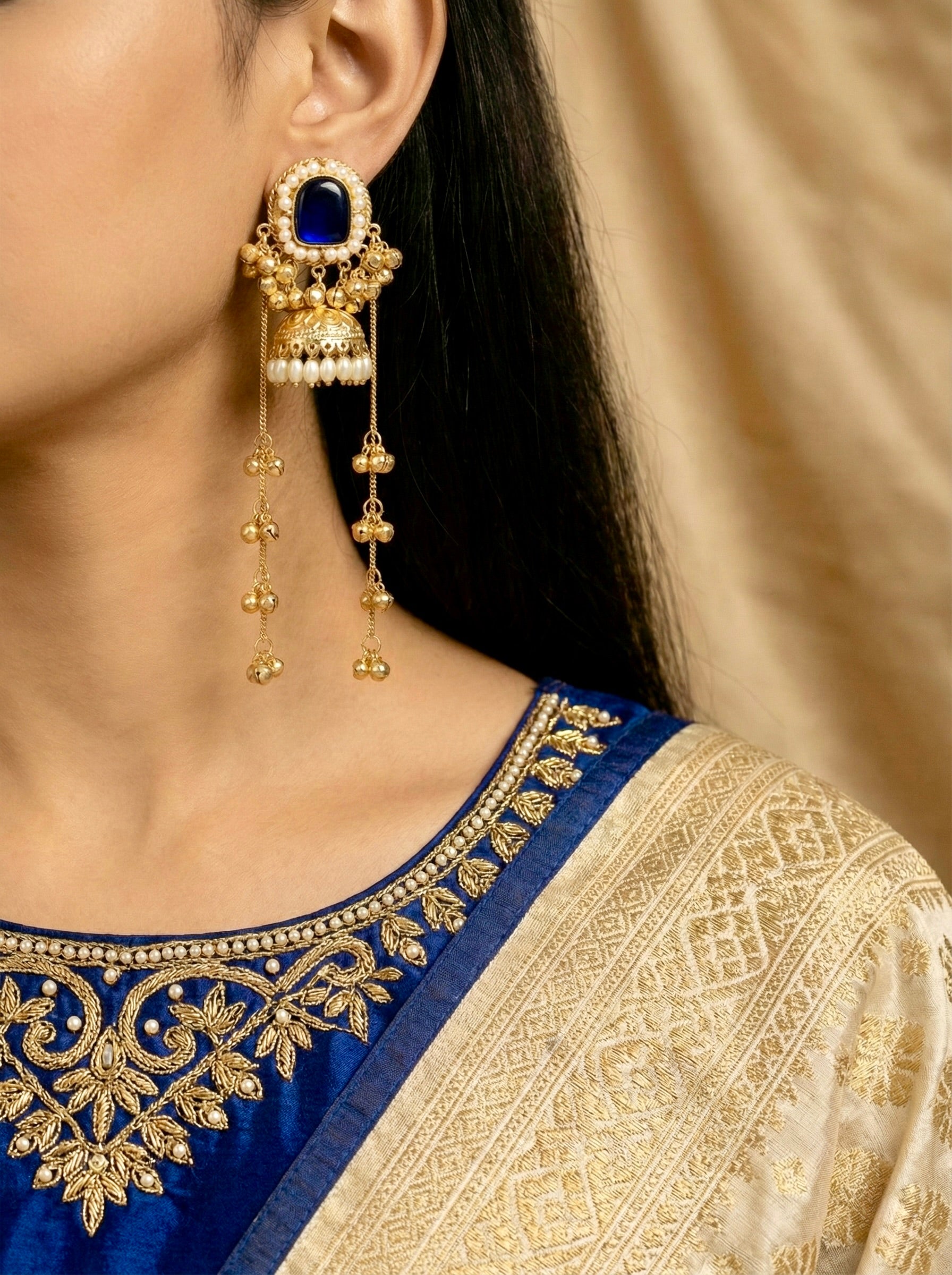 Antique Gold Jhumar Earrings with Deep Blue Stones and Pearl Tassels on Model