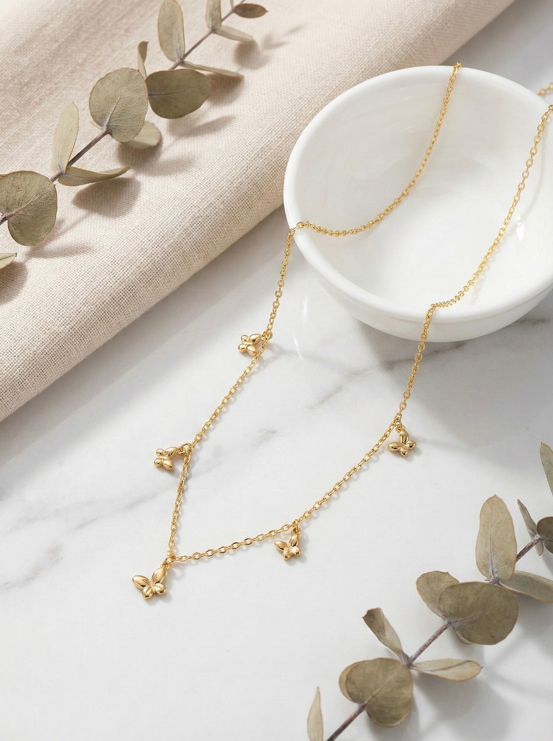Elara butterfly charm necklace in gold with anti-tarnish finish and delicate chain design