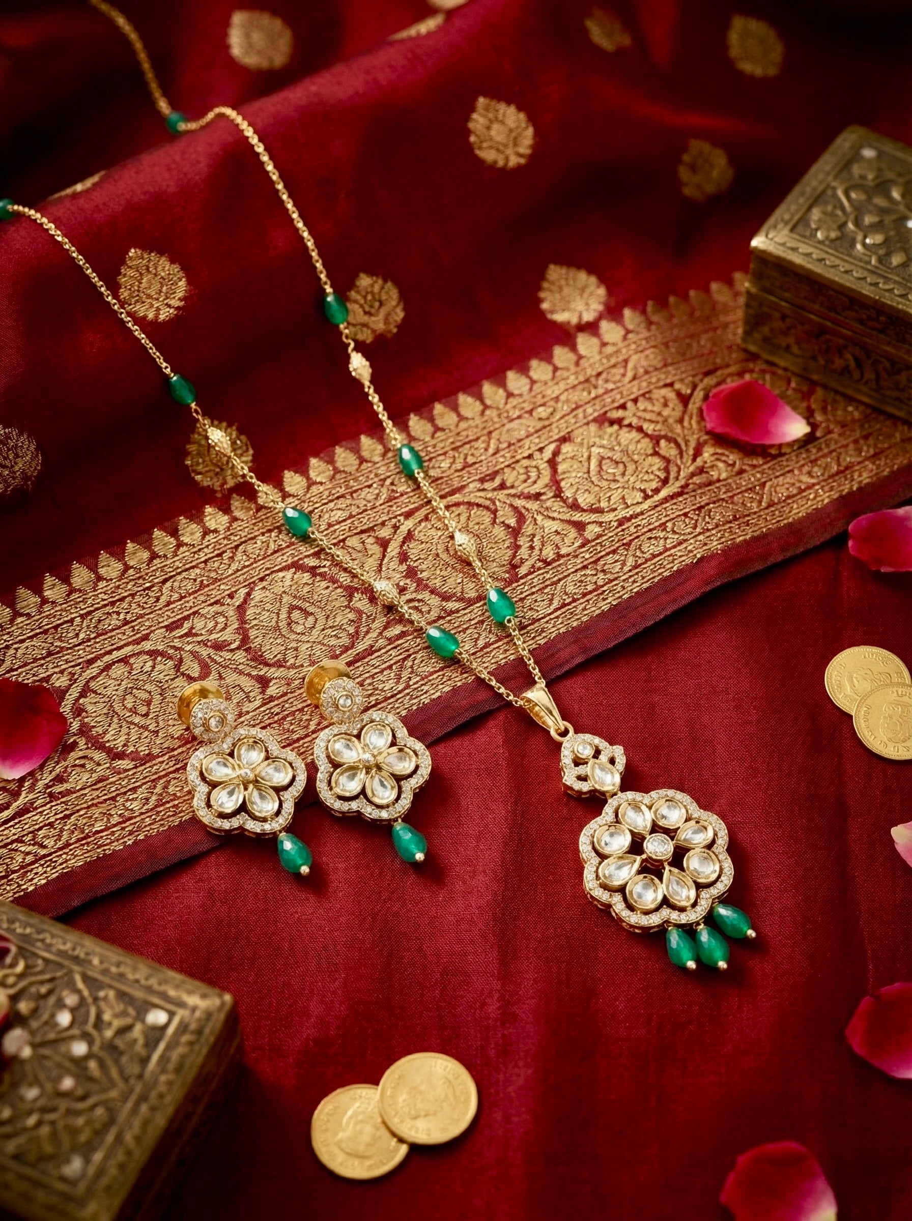 Emerald Pushpa Grace kundan necklace set with green bead drops and matching earrings in anti-tarnish gold finish