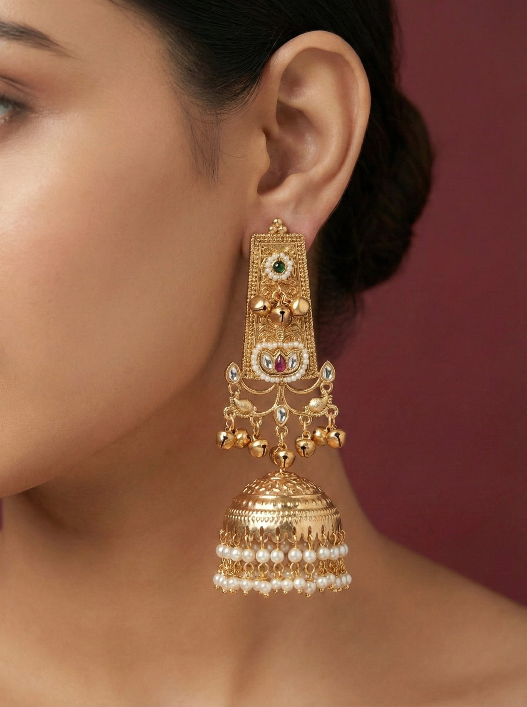 Antique Gold Pearl Jhumka Earrings with Green and Red Stones on Model