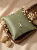 Front view of anti-tarnish gold floral floria bud CZ pendant necklace with delicate chain