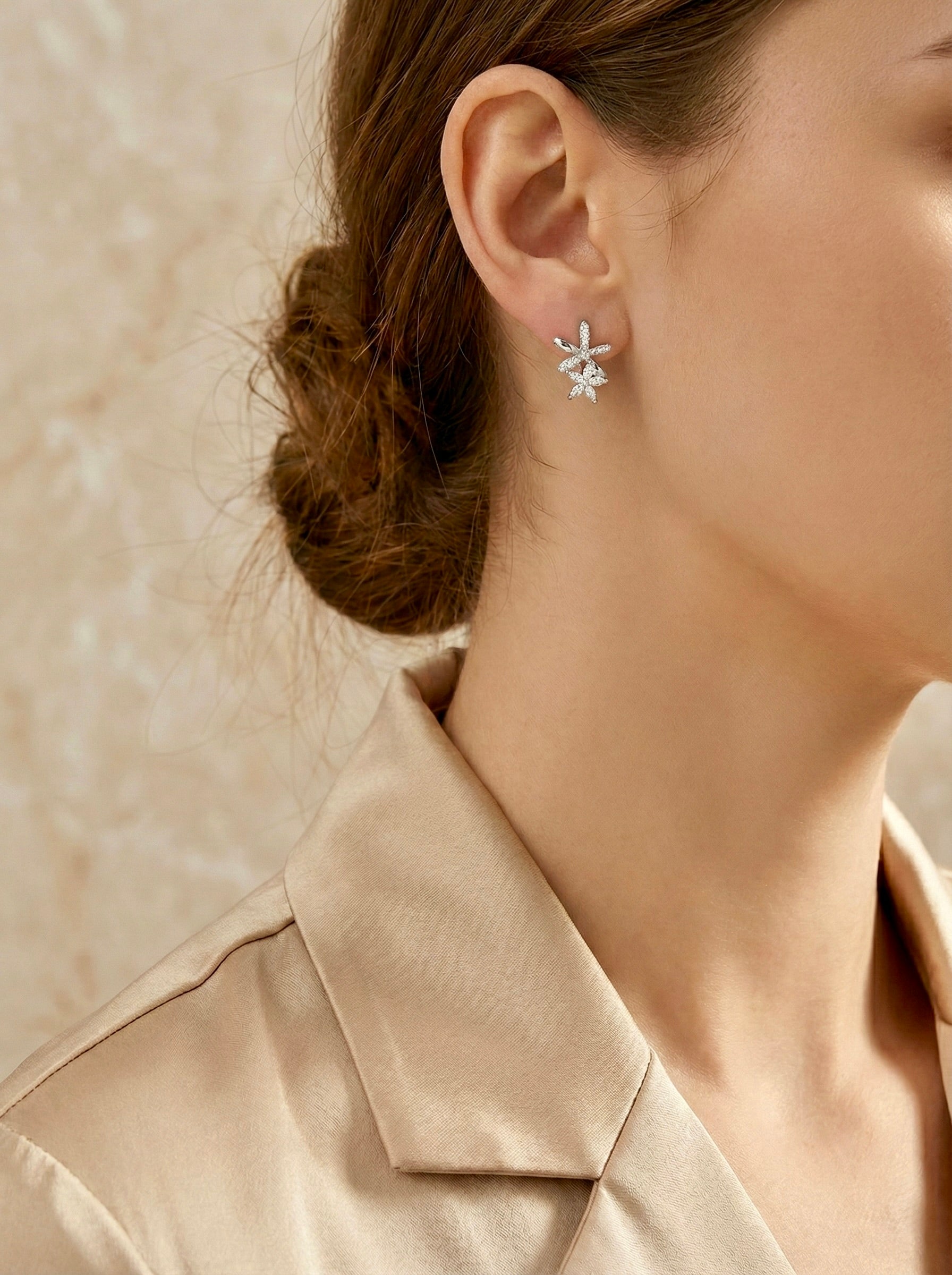 Anti-tarnish floral crystal silver hoop earrings styled with outfit