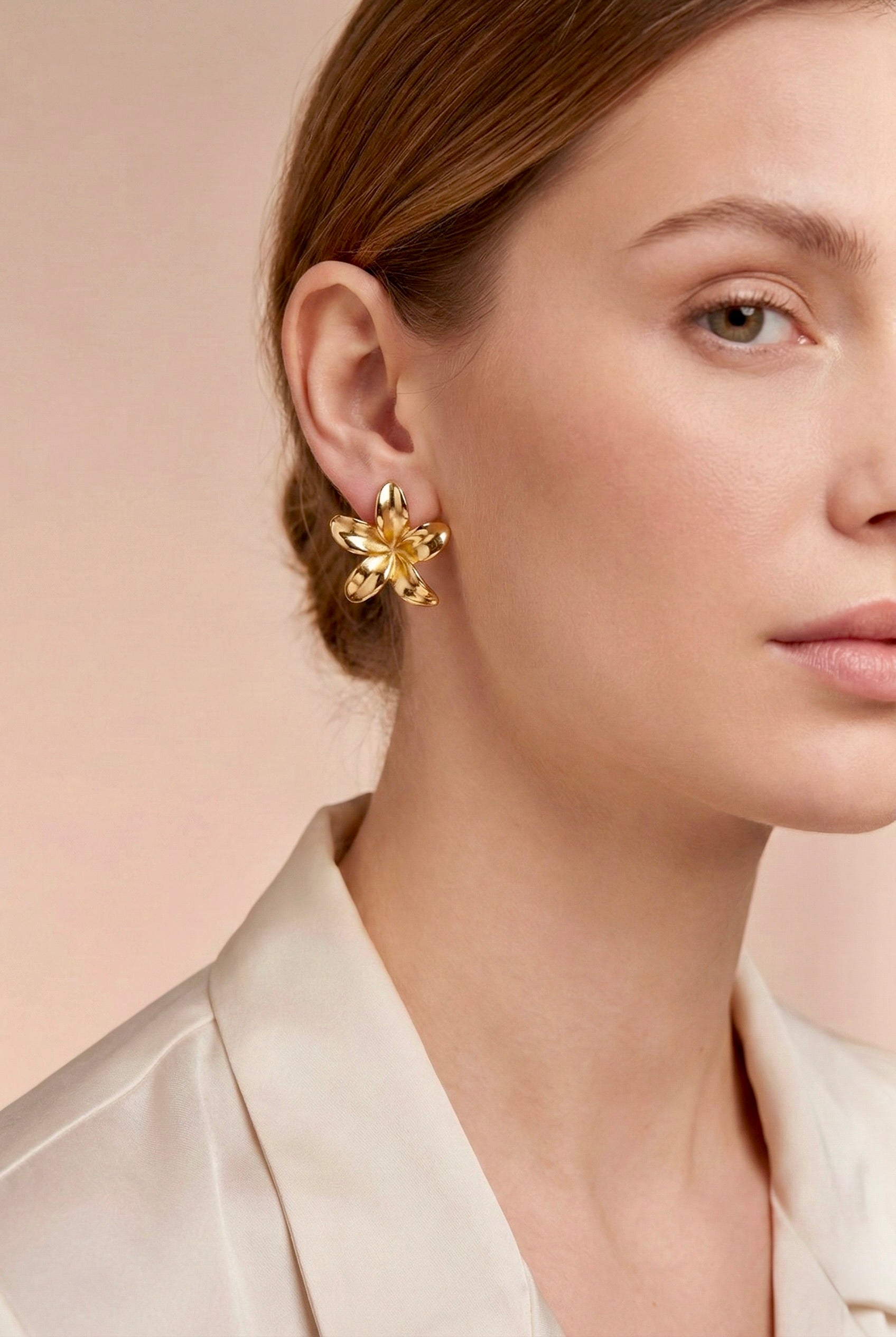 Gold floral aurelisse stud earrings on model for everyday sparkling elegance