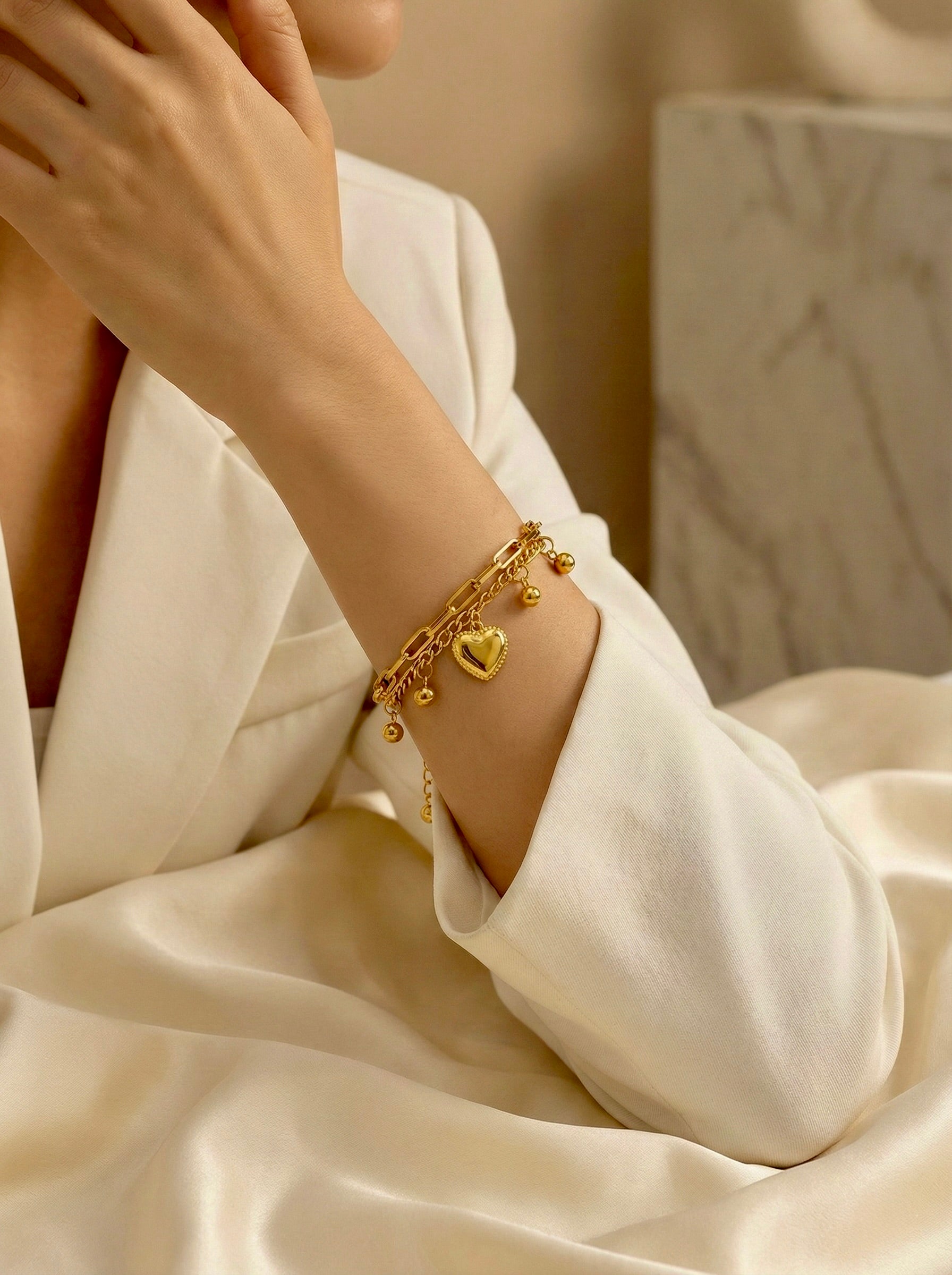 Minimal heart charm bracelet on model for everyday elegance