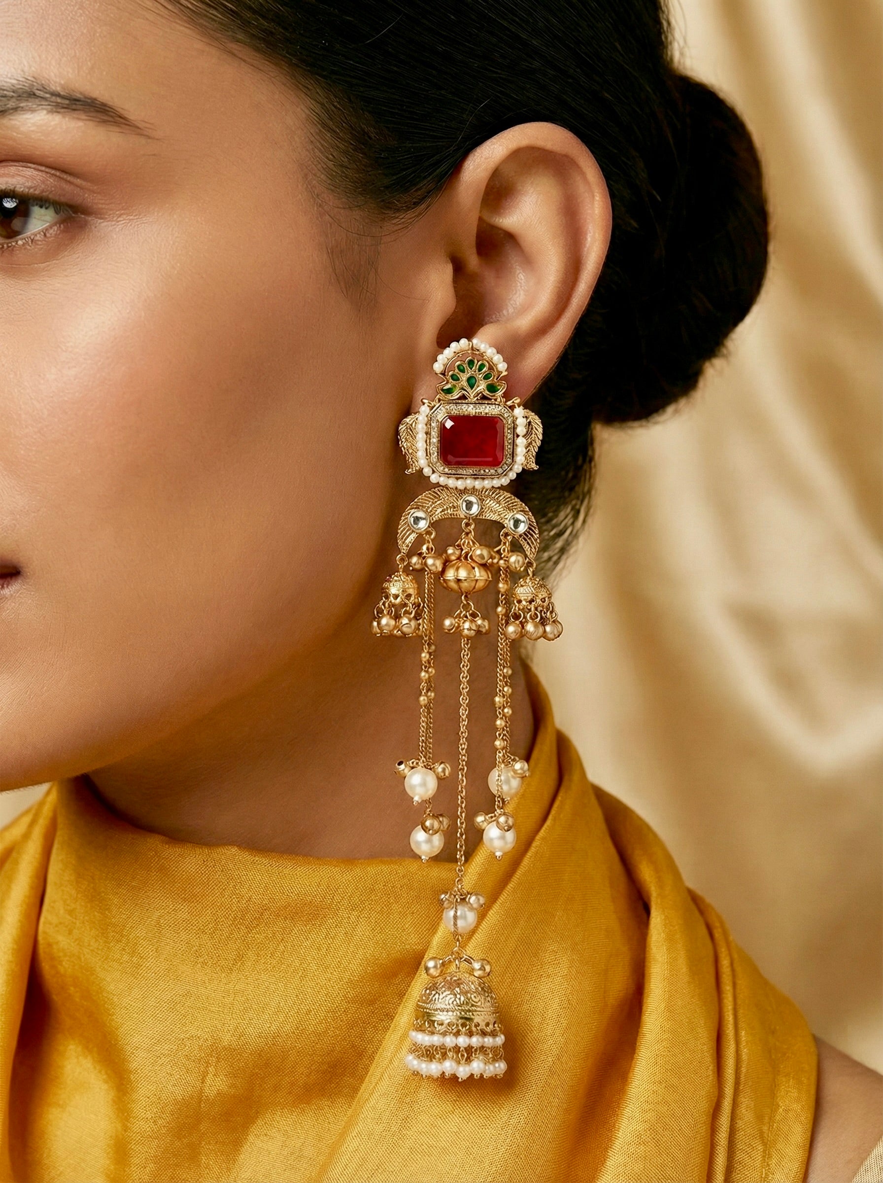 Close-up of a woman wearing a Red Jhumar Passa – Pearl Chain Tassels
