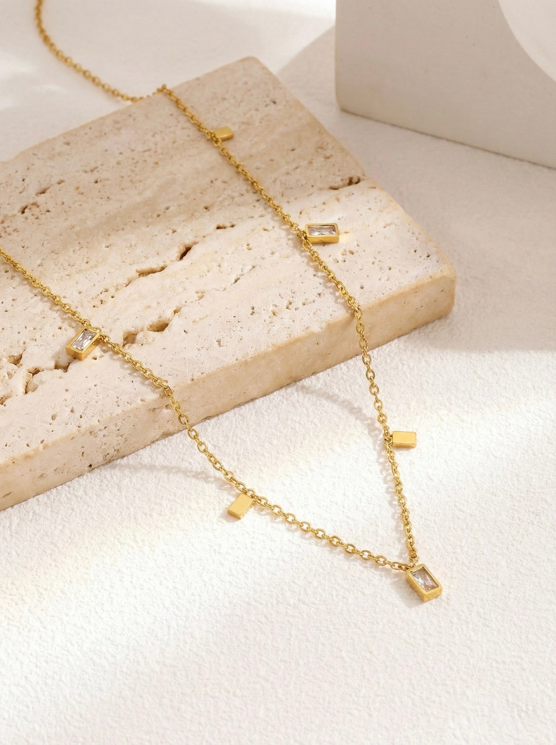 Minimal gold lumera quad necklace with rectangular crystal station charms for everyday wear