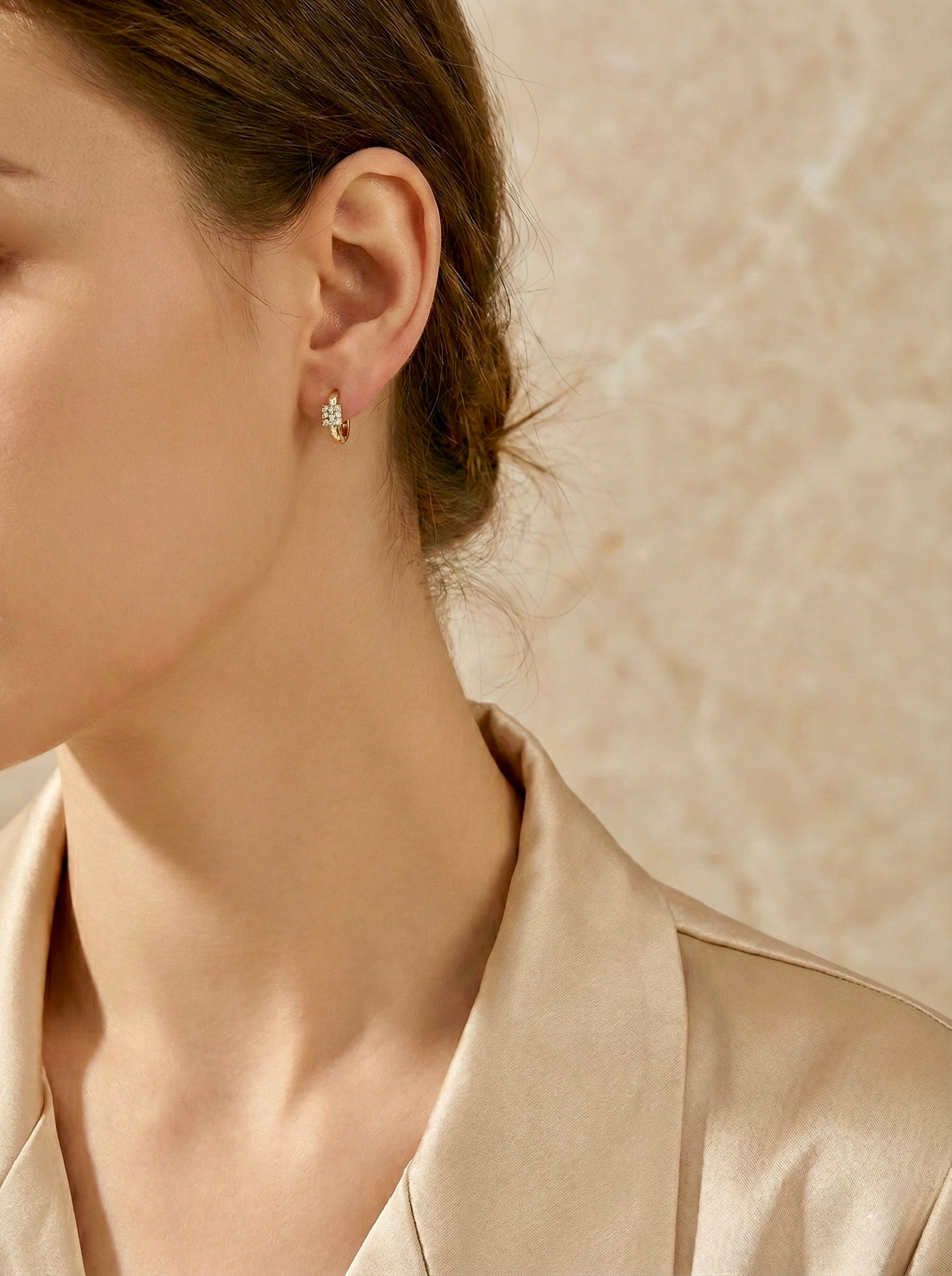 Minimal crystal hoop earrings on model for everyday elegance
