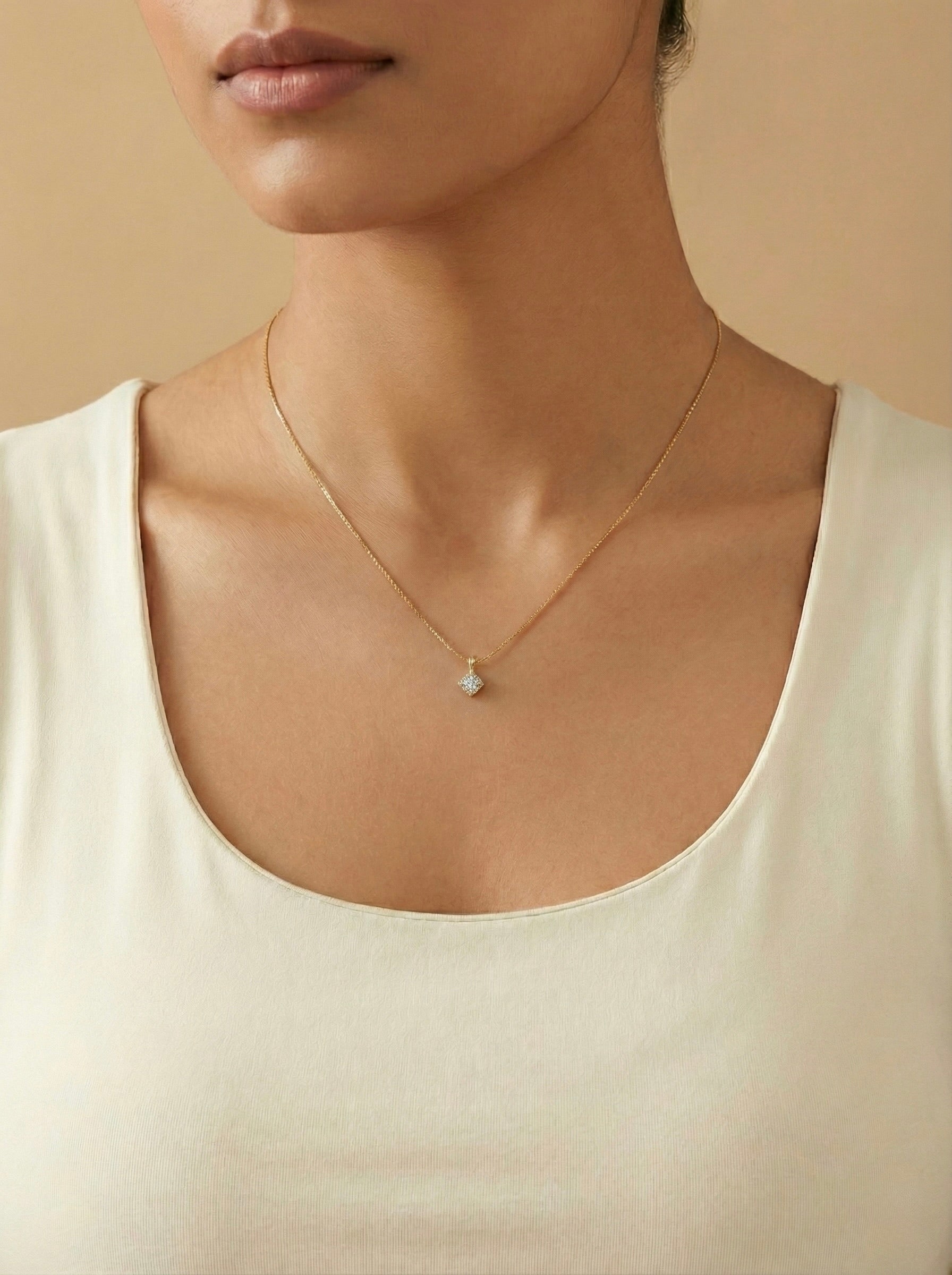 Minimal gold Zyelle square CZ solitaire necklace with square cubic zirconia pendant on model