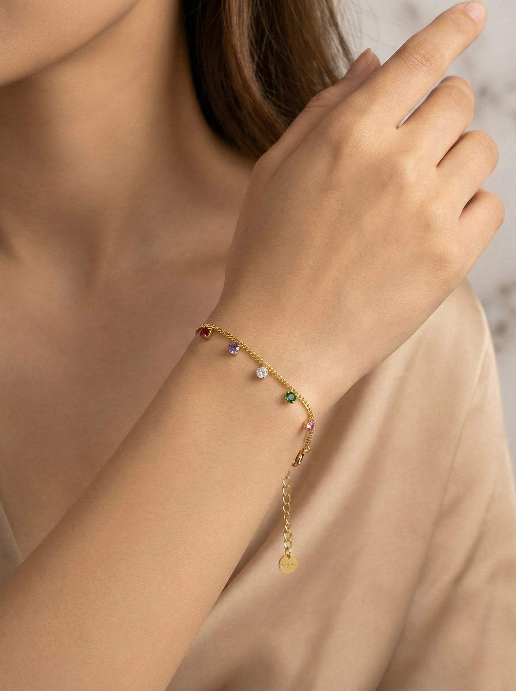 Multi-colour CZ aurielle prism charm bracelet on wrist for effortless everyday style
