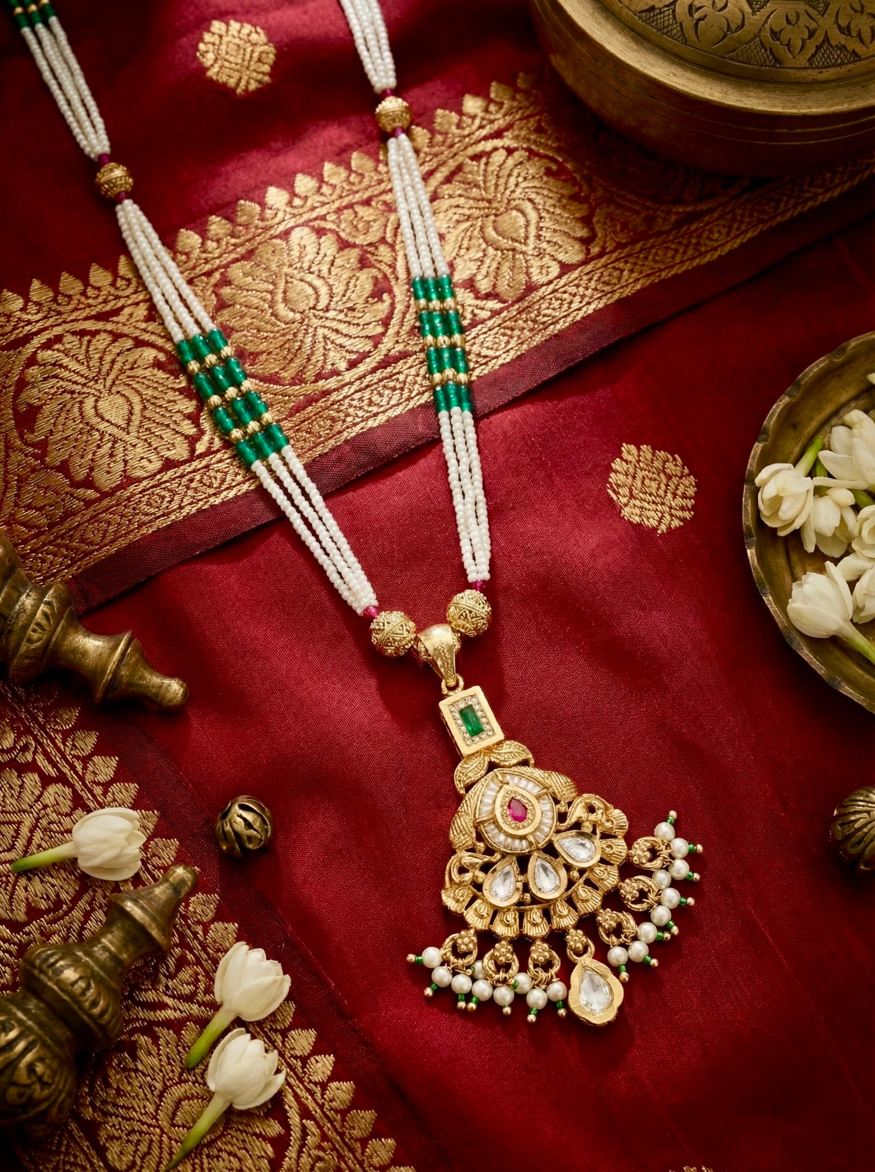 Close-up of Neelambari Pearl Royale necklace with multi-strand pearls and kundan pendant