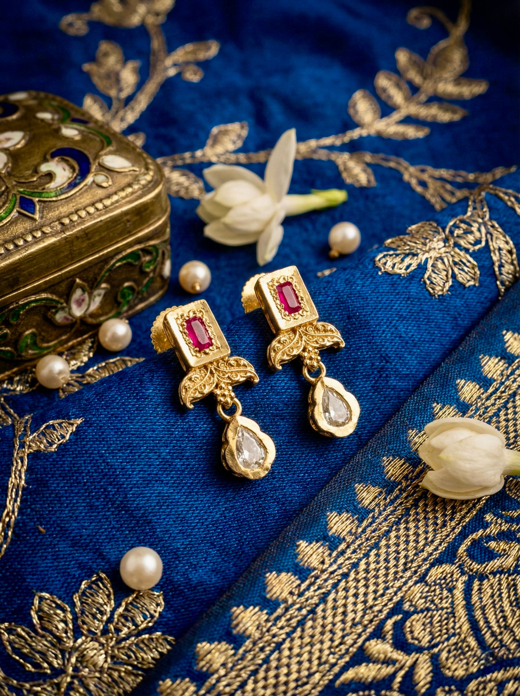 Close-up of matching Neelambari Pearl Royale kundan earrings with pearl accents