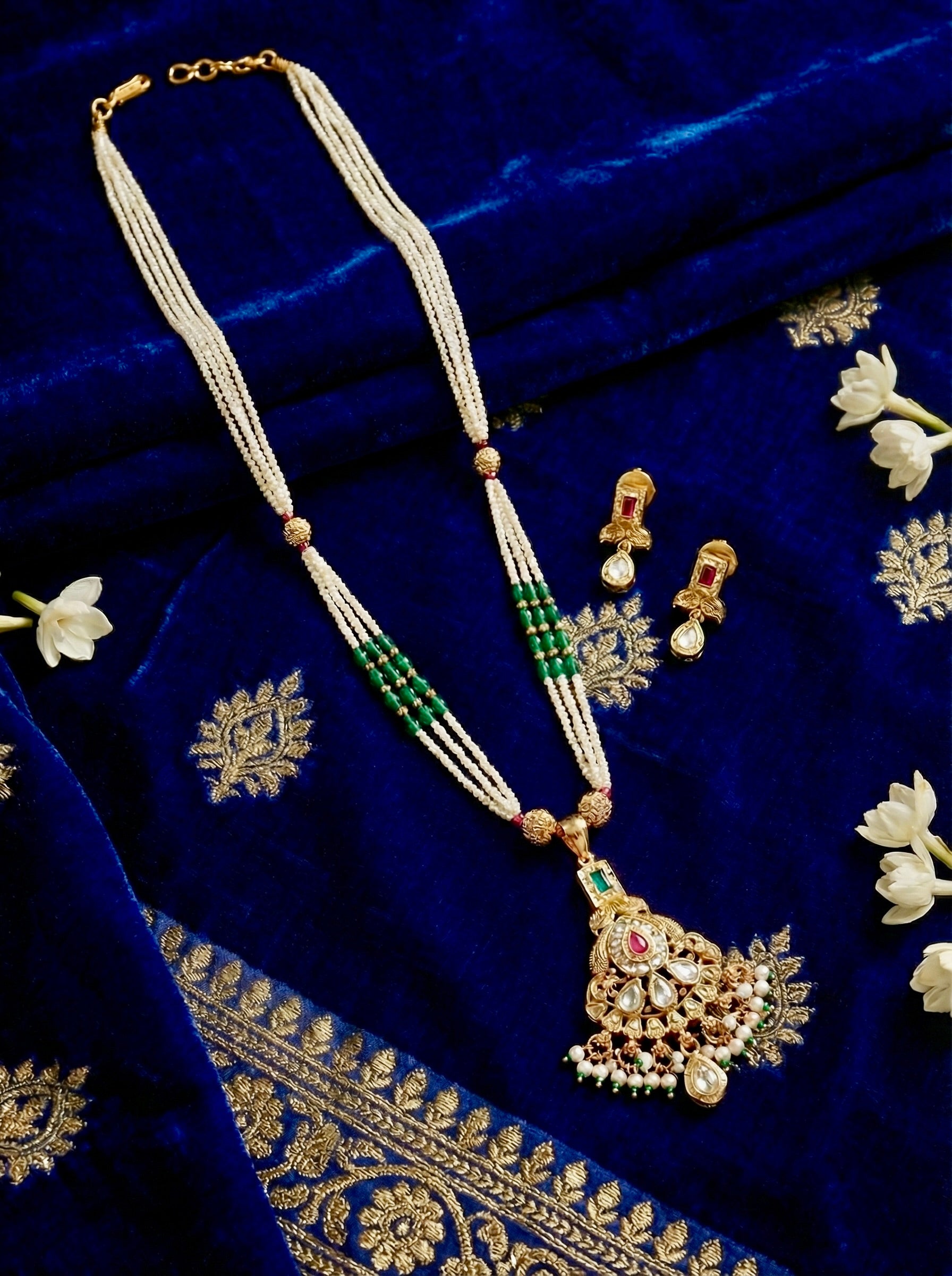 Neelambari Pearl Royale multi-strand pearl necklace set with kundan pendant and matching earrings