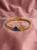 Nolira twin clover cuff bracelet in anti-tarnish gold finish with adjustable design for women by Sajheera.com