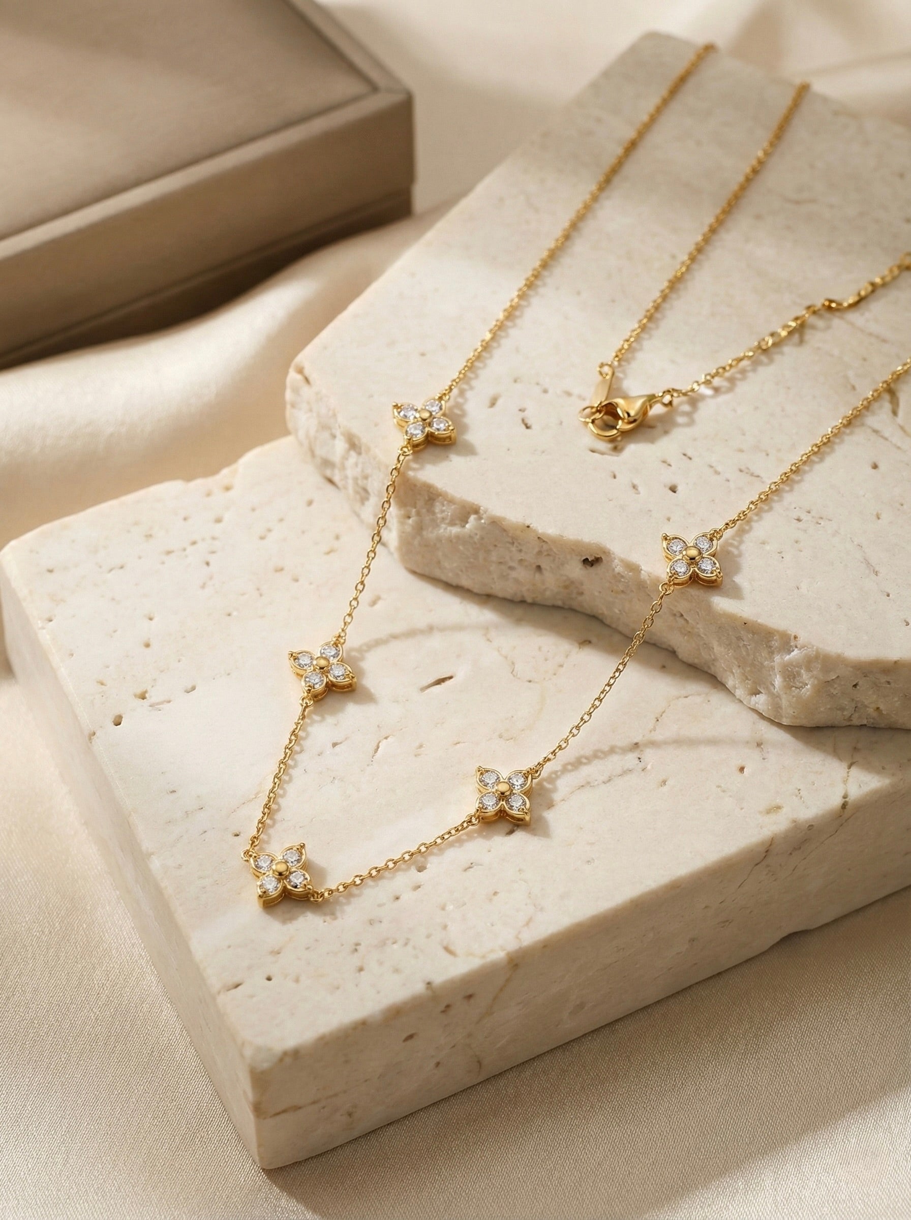 Noor floral station necklace in anti-tarnish gold finish with CZ accents for women