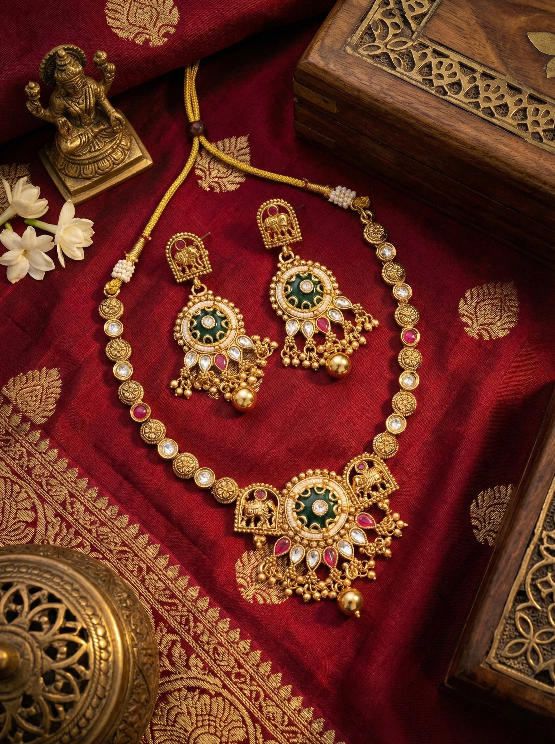 Rajeshwari Heirloom antique gold kundan necklace set with green stone pendant, matching earrings & maang tikka