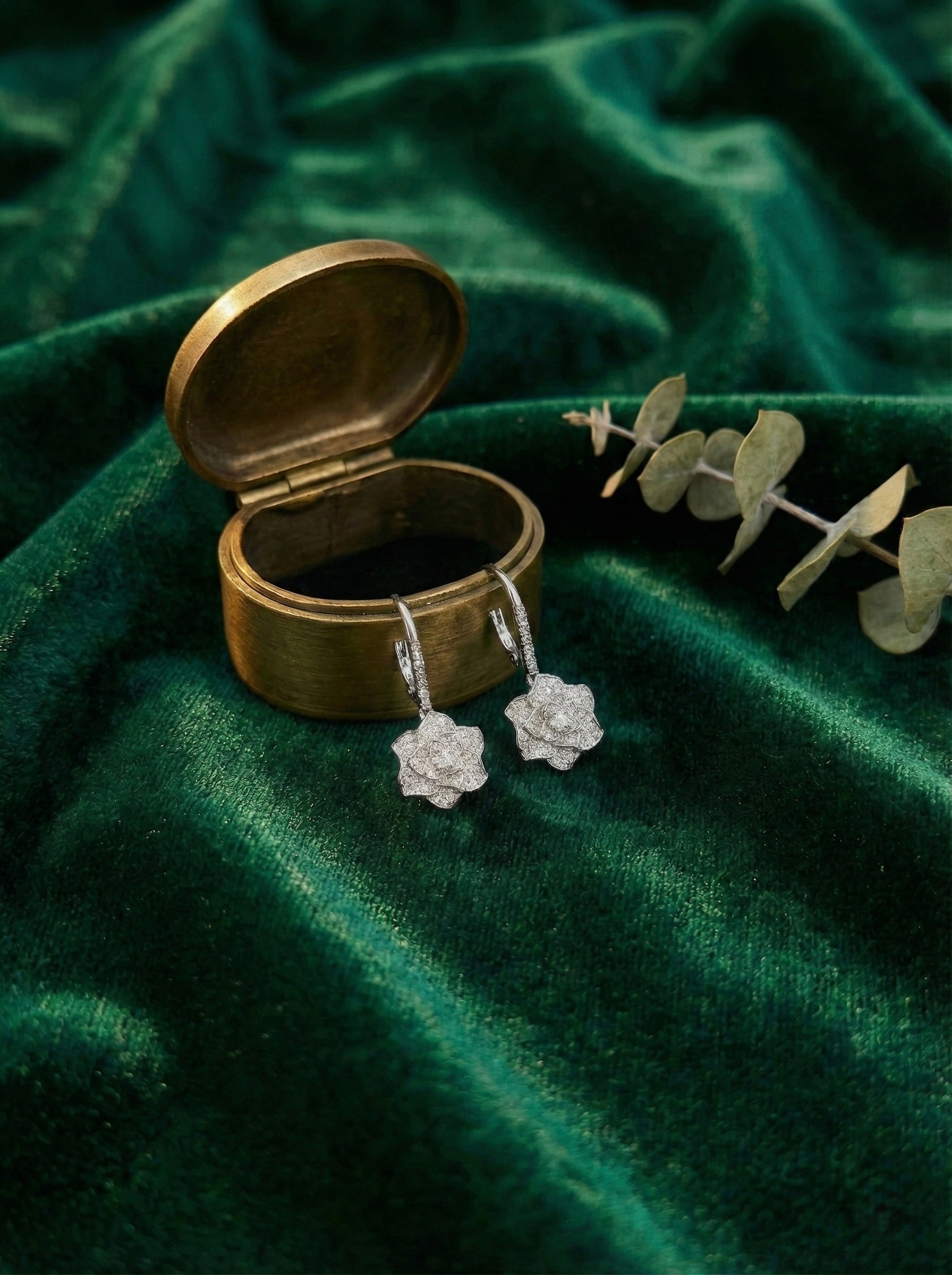 Close-up of Roselle Bloom silver floral CZ drop earrings showing detailed crystal petals