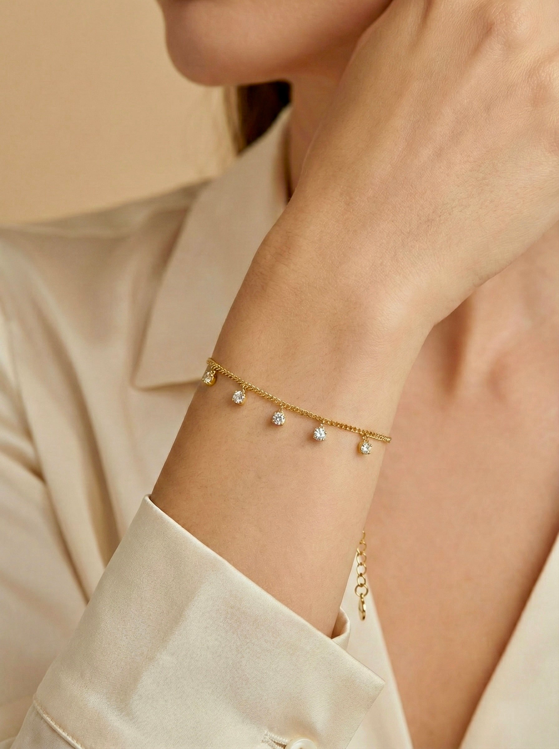 Sparkling minimal gold CZ bracelet styled with casual outfit