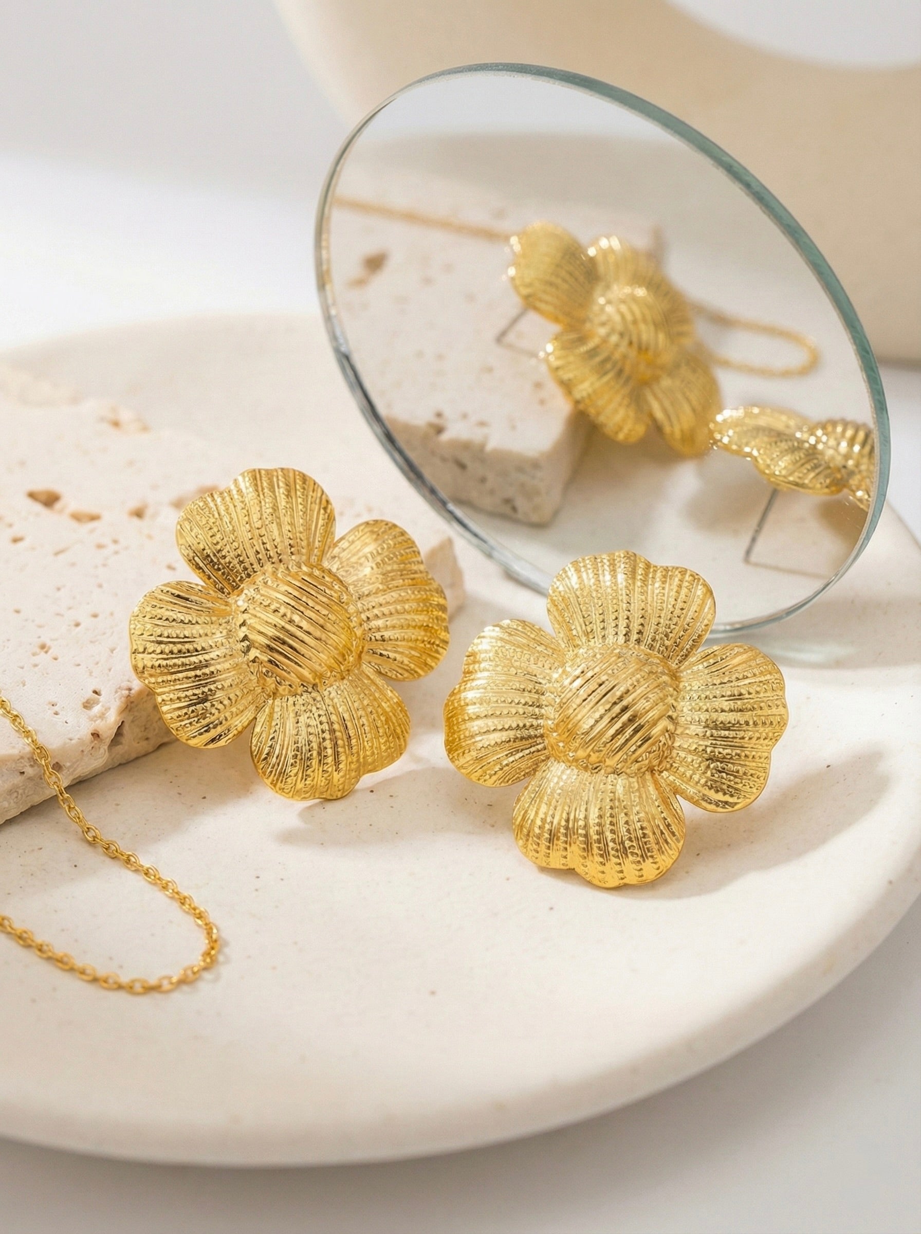 Close-up of The Bloom Studs anti-tarnish gold floral textured stud earrings