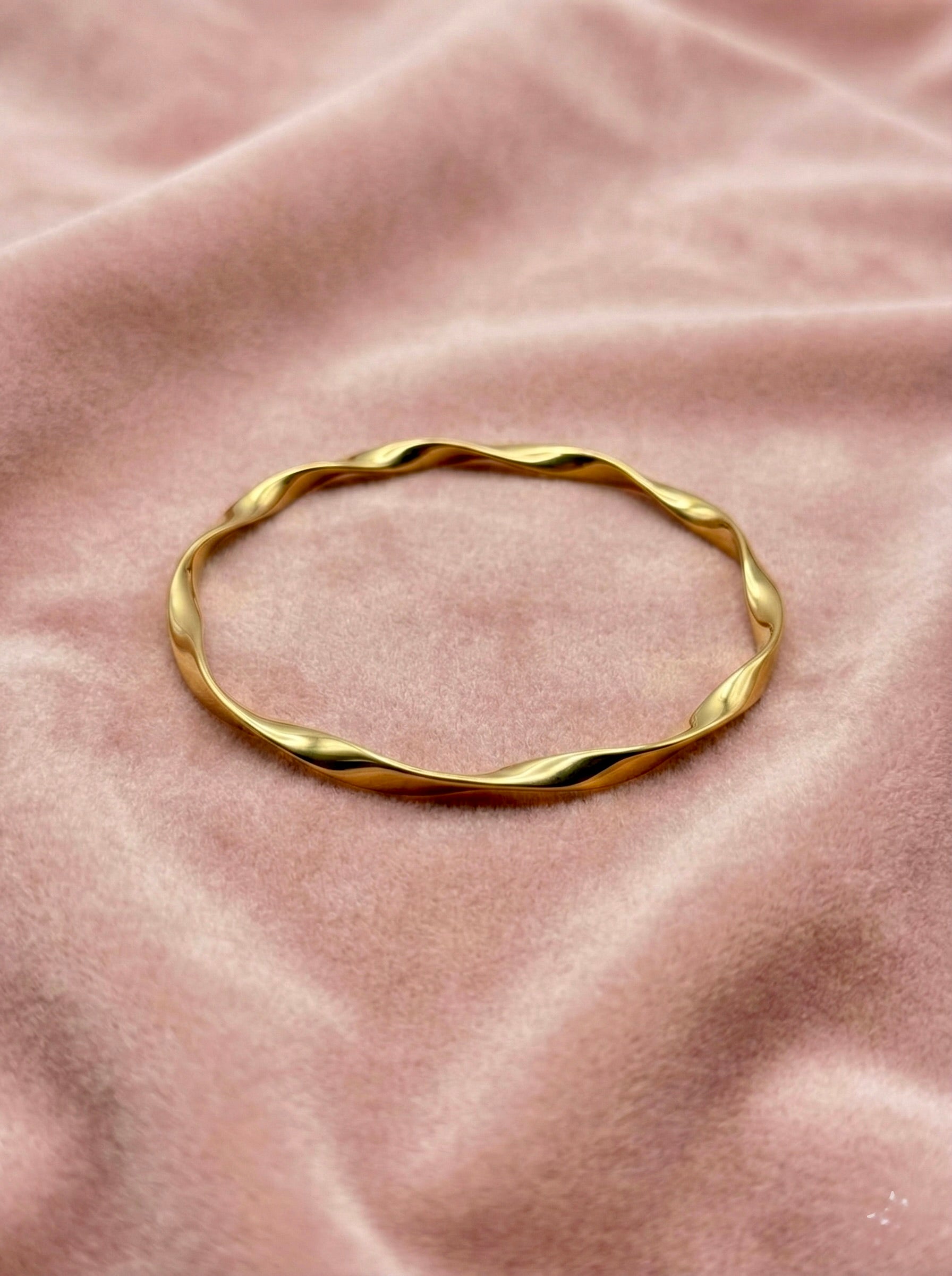 Close-up of Twylia Twist anti-tarnish gold bracelet showing twisted design