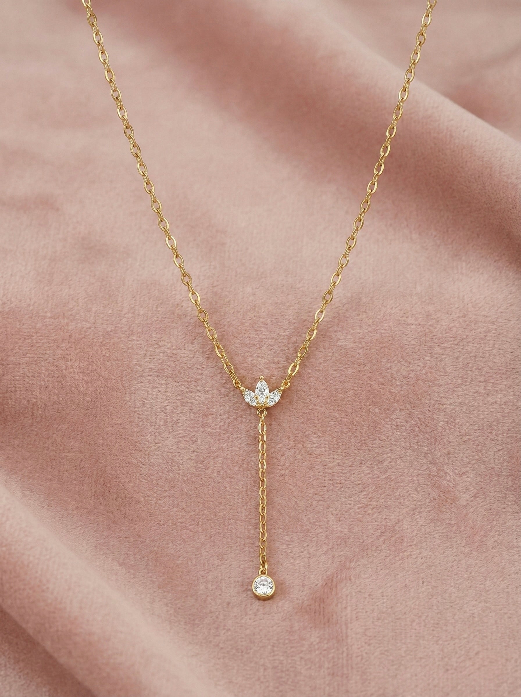 Close-up of sparkling CZ on gold dropline Y necklace