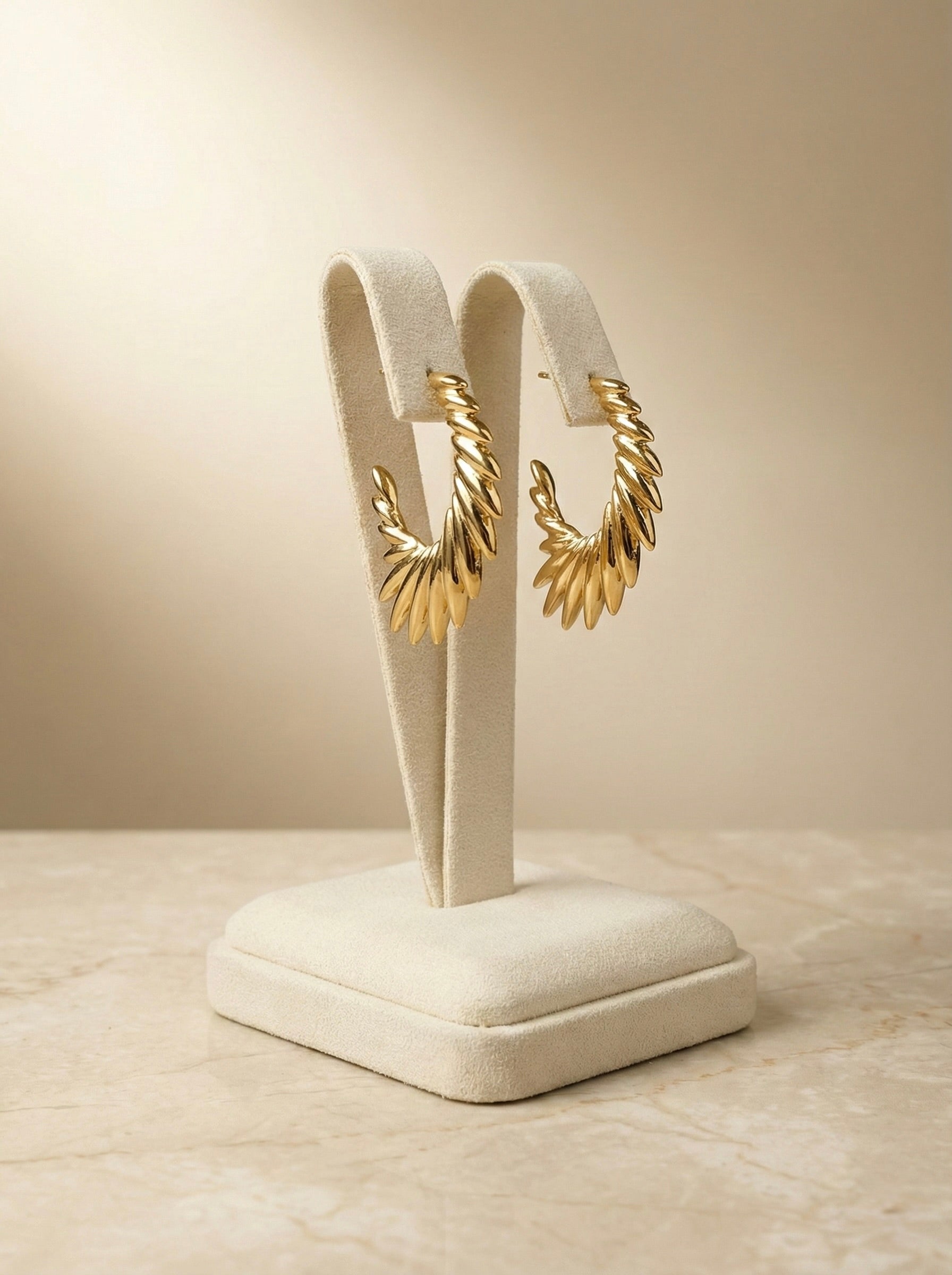 Side view of Zarielle Sunburst anti-tarnish gold hoop earrings for women