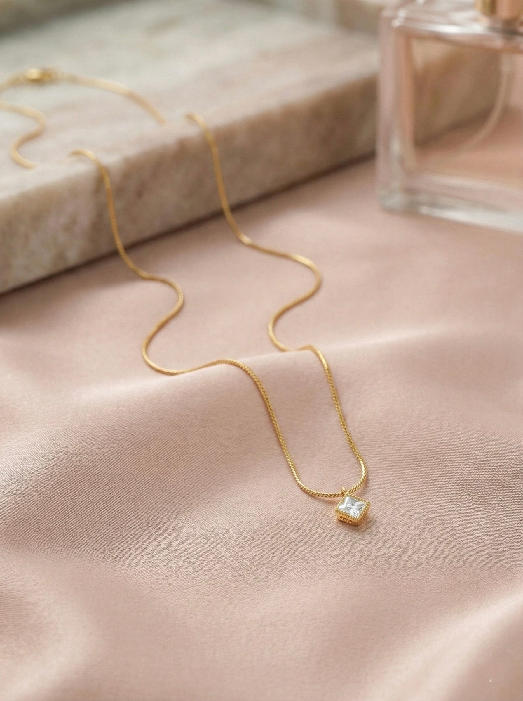 Zyelle square CZ solitaire necklace in gold with anti-tarnish finish